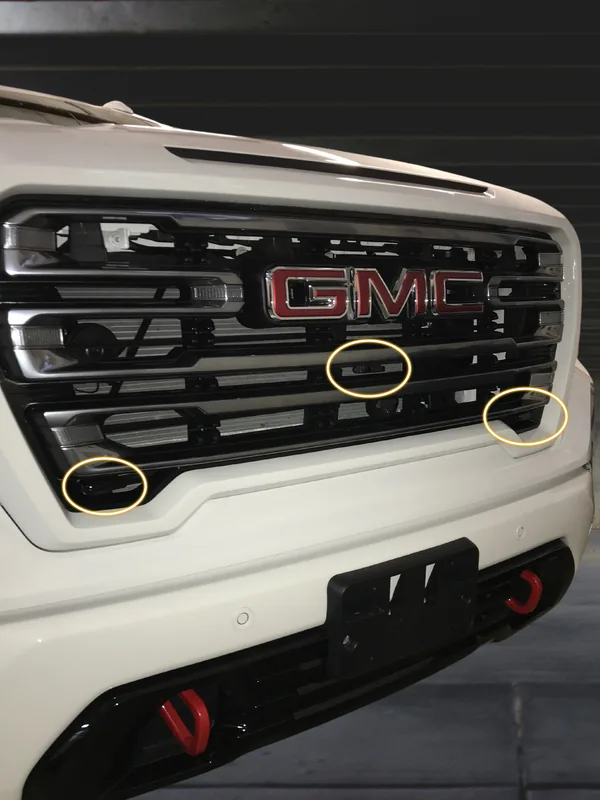 Dual laser shifter sensors mounted in the front grille of a GMC