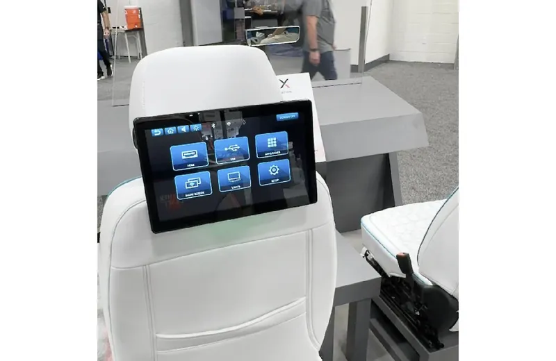 Headrest-mounted touchscreen for rear-seat passengers, installed by Xclusive Autosound, Belleville IL